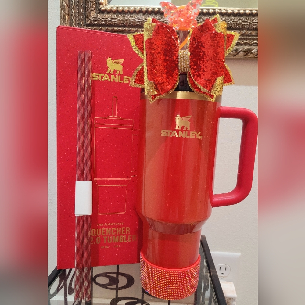 Stanley Scarlet Tinsel Travel Tumbler with Handle, Bow, and Boot.